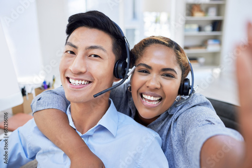 Selfie, happy and friends in a call center for customer service, support or advice with a smile together. Portrait, diversity or crm business with a man and woman consultant in the workplace photo