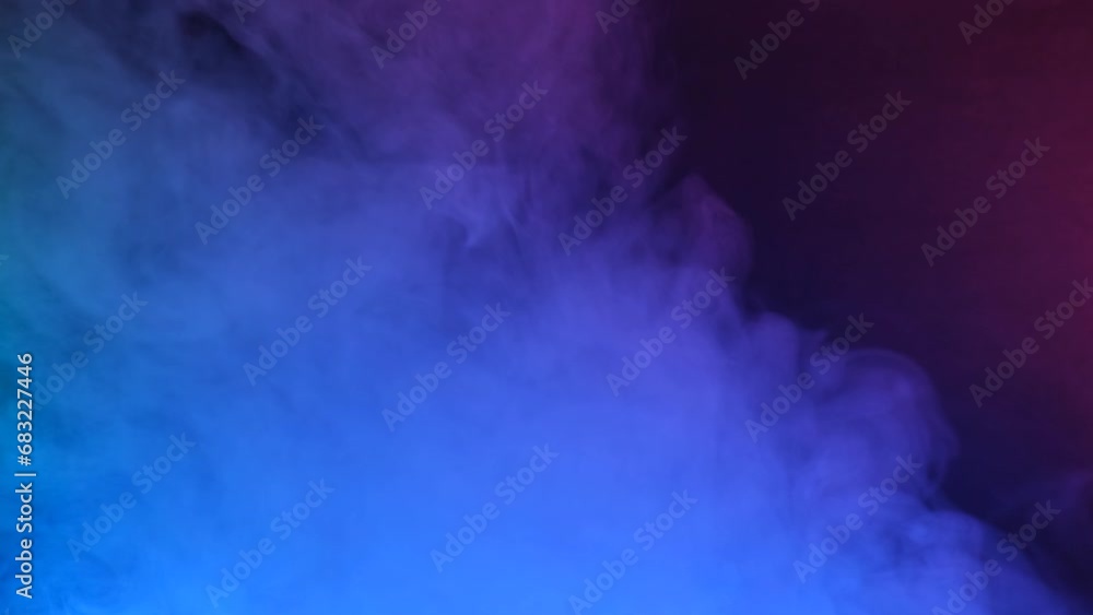 Texture of multi-colored smoke on a black background, slow motion. Texture of multi-colored smoke on a black background, slow motion.