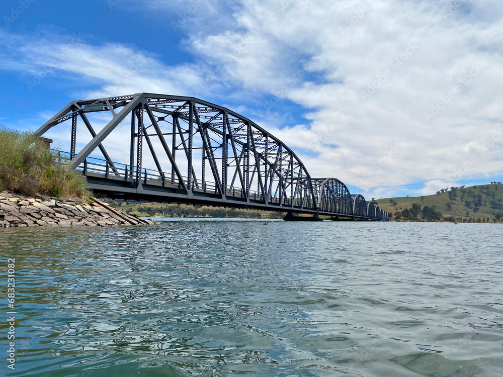 Obraz premium The Bethanga or BellBridge Bridge is a steel truss road bridge that carries the Riverina Highway across Lake Hume, an artificial lake on the Murray River in Australia.