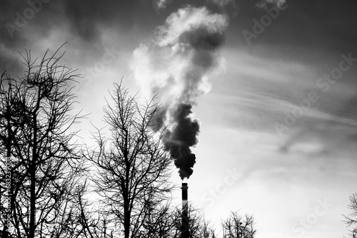 Emission of smoke and vapors from the chimney of an industrial plant into the environment. Environmental pollution, smoke from the factory.