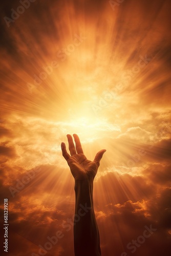 inspirational hand reaching out to faith, the sky with the sun behind. reaching for God's love   photo