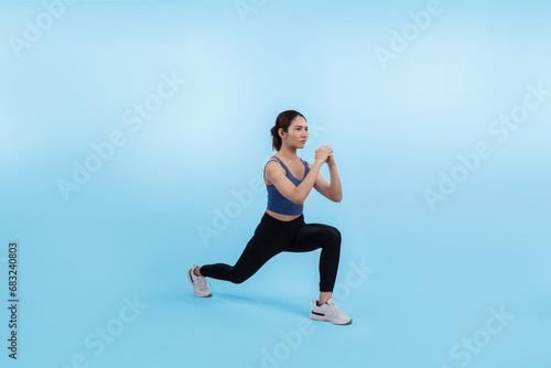 Young attractive asian woman in sportswear stretching before fitness exercise routine. Healthy body care workout with athletic woman warming up on studio shot isolated background. Vigorous