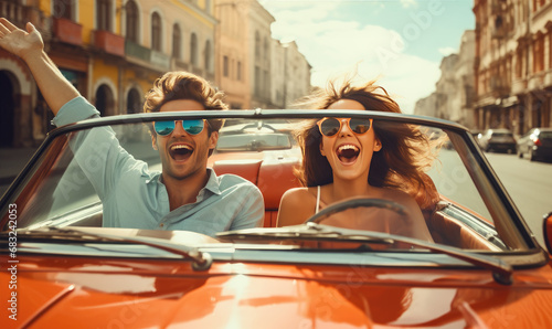 Happy young couple is enjoying ride in a cabriolet car during summer sunny day, active lifestyle concept photo