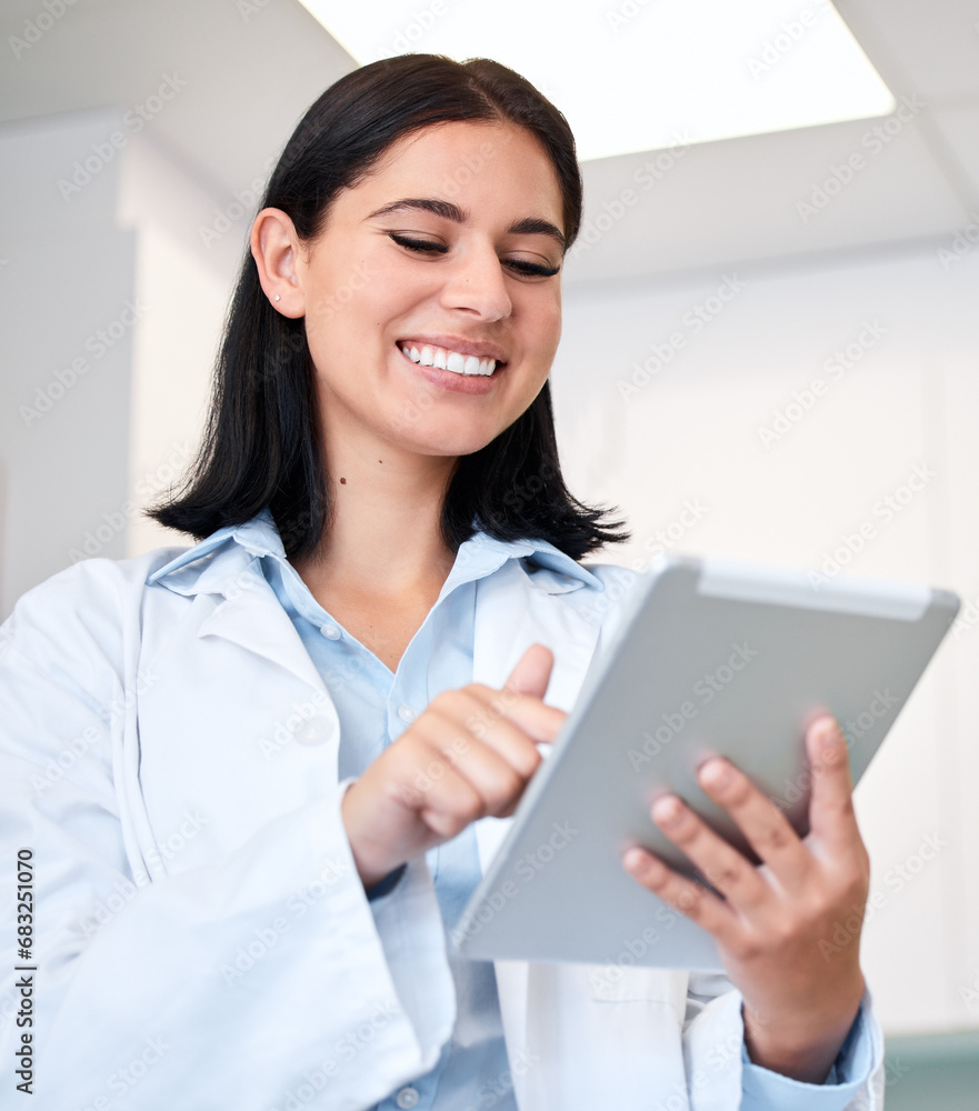 Smile, tablet and young woman doctor with confidence in her office doing research at clinic. Happy, medical and professional female healthcare worker from Canada with digital technology in hospital. Smile, tablet and young woman doctor with confidence in her office doing research at clinic. Happy, medical and professional female healthcare worker from Canada with digital technology in hospital.
