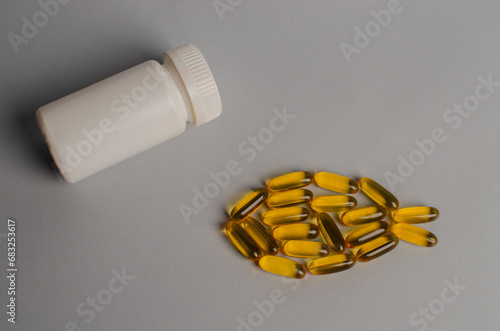 Omega 3 capsules - fish shape. Top view, copy space, high resolution product. Health care concept