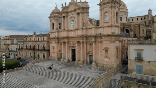 Italy architecture and religion, ascending drone shot of beautiful cathedral (Basilica Cattedrale di San Nicolo) in Noto Sicily
 photo