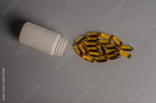 Omega 3 capsules - fish shape. Top view, copy space, high resolution product. Health care concept