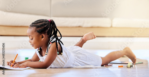 Child, book and colouring on floor, fun and learning for development, homework and playing at home. Black girl, education and creative project or art, notebook and homeschooling or happy drawing
