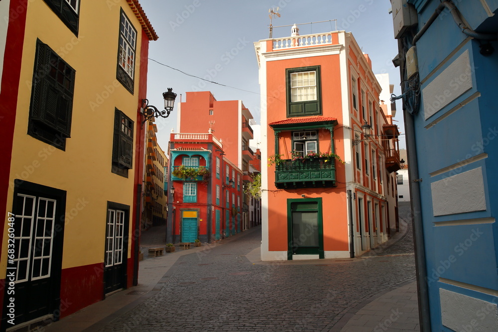 Traditional and colorful house facades located along a commercial street (calle Anselmo Perez de Brito) in Santa Cruz de la Palma, La Palma, Canary Islands, Spain