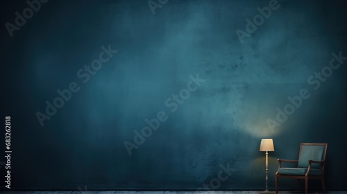 Empty dark blue wall with a armchair and a lamp.