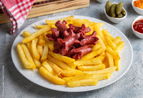 French fries and sausage fries platter (Turkish name; patates ve sosis kizartmasi) photo