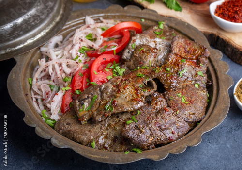 Traditional Turkish Liver kebab cuisine. Leaf Liver spicy. Delicious turkish ciger. (Turkish name; yaprak ciger) photo