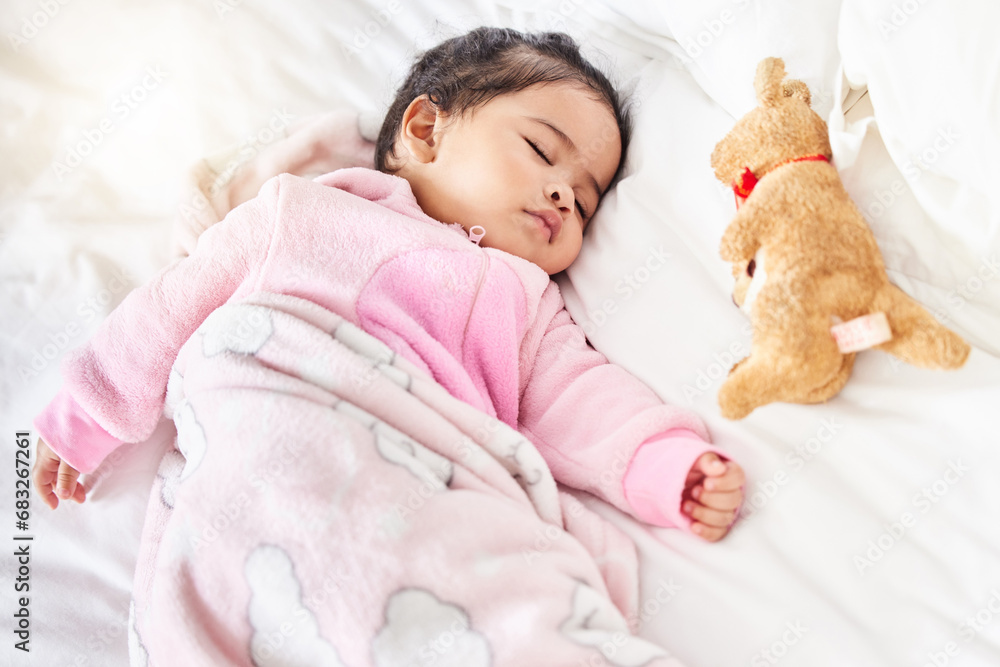 Baby, sleeping and girl in bed with teddy bear, animal and peace in home with blanket and comfort. Child, rest and sleep in morning, nap and routine for health, wellness and calm face of infant Baby, sleeping and girl in bed with teddy bear, animal and peace in home with blanket and comfort. Child, rest and sleep in morning, nap and routine for health, wellness and calm face of infant