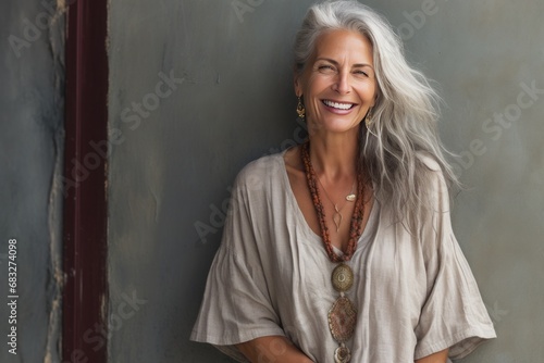 portrait of a beautiful 50s mid age beautiful senior model woman with grey hair smiling
