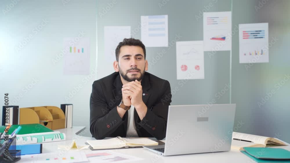 Businessman thoughtful in his office. Businessman thoughtful in his office.