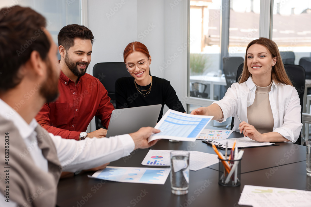 Team of employees working together in office Team of employees working together in office