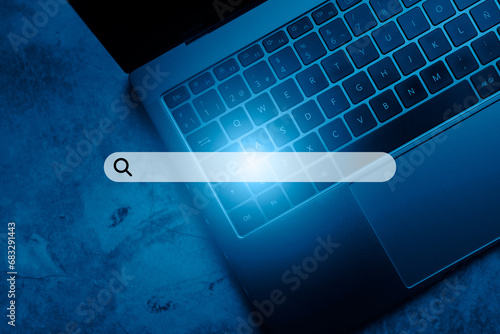 Laptop keyboard top view with VR search bar. SEO. Browser technology. Concept of searching on internet with copy space.