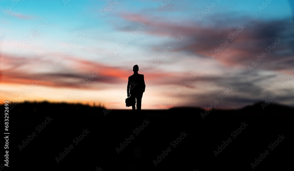 silhouette of a  businessman in the sunset