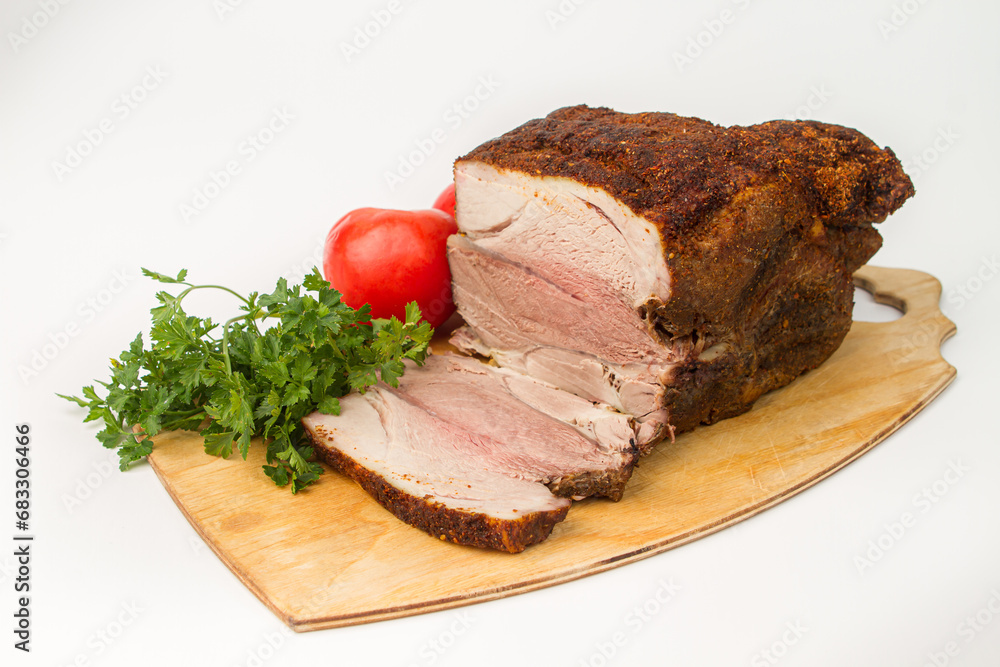 Sliced baked meat on a white background. Delicious homemade meat meal Sliced baked meat on a white background. Delicious homemade meat meal