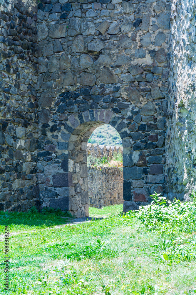 Khertvisi Fortress, Georgia, a medieval castle with watchtowers and citadel on a green rocky mountain in the mountains of the Lesser Caucasus in Samtskhe - Javakheti (Meskheti).