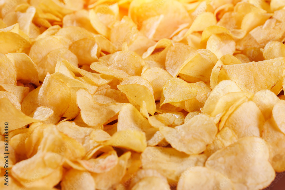 Food Texture of Fresh Crispy potato chips snack background, top view Food Texture of Fresh Crispy potato chips snack background, top view