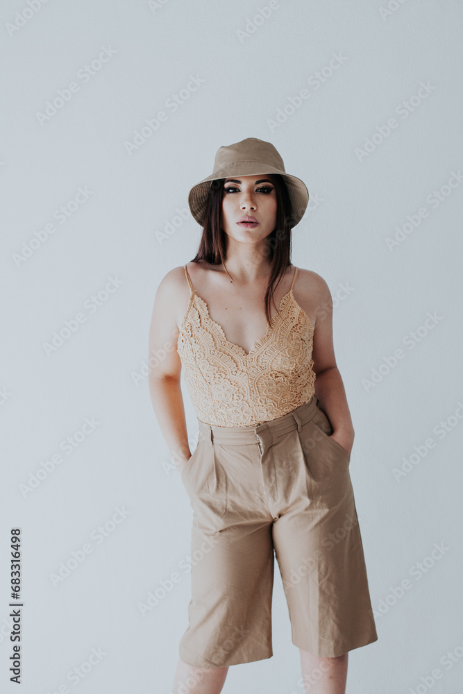 Beautiful brunette in panama hat on white background Beautiful brunette in panama hat on white background