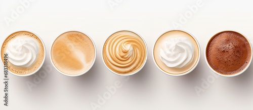 Latte coffee in a paper cup viewed from above white background photo