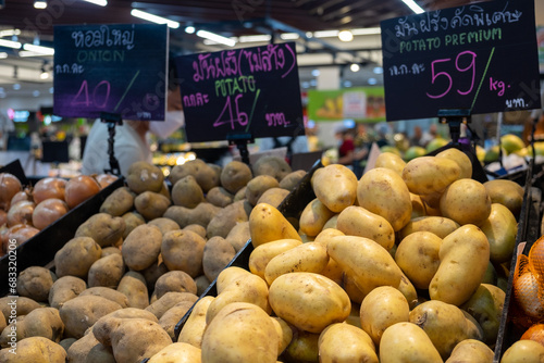 A Variety of Potatoes in the Market with Sign