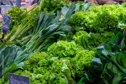 fresh green vegetables on stall in the market