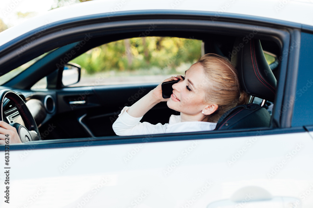 Woman talking on the phone while driving a car travel