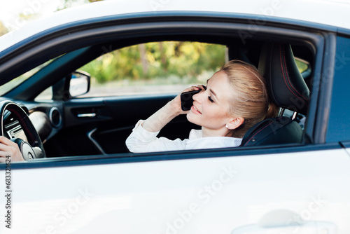 Woman talking on the phone while driving a car travel © dmitriisimakov