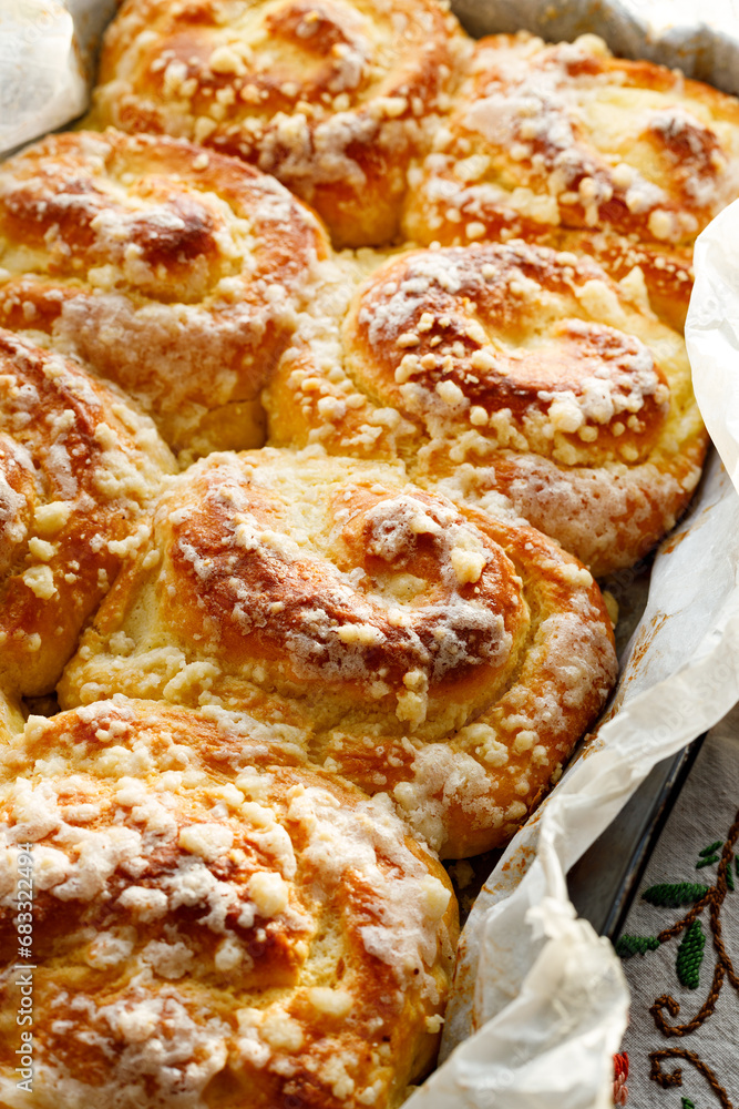 Close up view of homemade cheese sweet rolls with butter crumble, focus on the bun inside. Close up view of homemade cheese sweet rolls with butter crumble, focus on the bun inside.