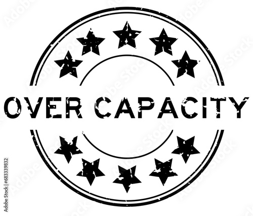 Grunge black over capacity word with star icon round rubber seal stamp on white background