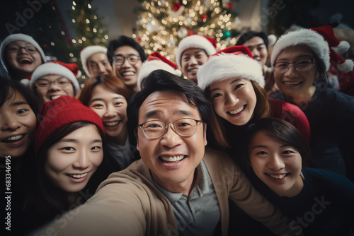 Group of happy Asian friends or family celebrate Christmas at home. Celebration and party concept