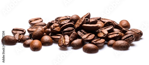 Top view of isolated white background with pile of roasted coffee beans