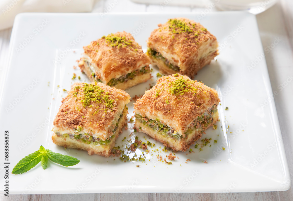 Traditional turkish new dessert cold milky baklava with pistachio (Turkish name; soguk baklava)