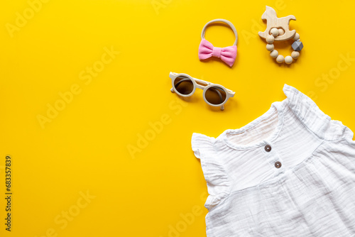 Fashion trendy look of baby girl with white dress and accessories photo