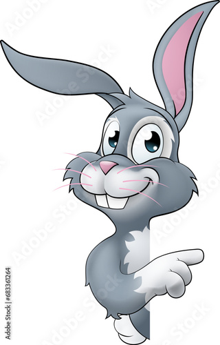 An Easter bunny rabbit cartoon character peeking around a sign