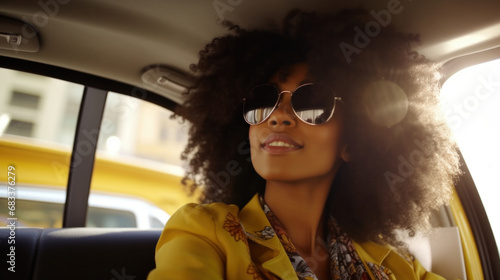Stylish young woman with curly hair wearing sunglasses in a car, exuding cool elegance and modern lifestyle © Ai Studio