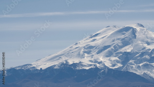 Alps cold mountain top, scenic winter landscape. Creative. Snow covered giant mountain peak.