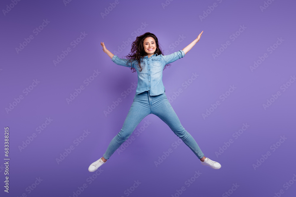Full body portrait of overjoyed satisfied young lady jumping make star figure isolated on purple color background