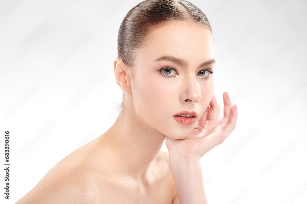 Fototapeta premium Beautiful young woman with clean fresh skin on white background, Face care, Facial treatment, Cosmetology, beauty and spa, women portrait.