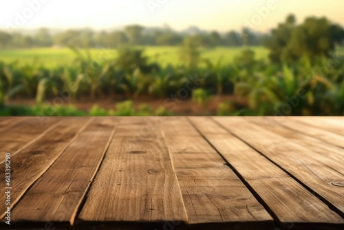 The empty wooden brown table top with blur background of farm and barn
