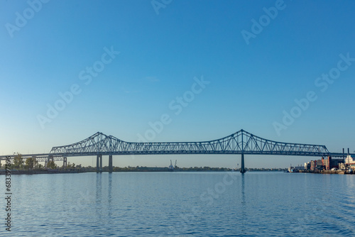 scenic morning view to Crescent City Connection bridge spanning the Mississippi river in New Orleans