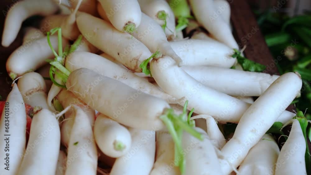 Organic local daikon radish vegetables for sale at outdoor asian marketplace Organic local daikon radish vegetables for sale at outdoor asian marketplace