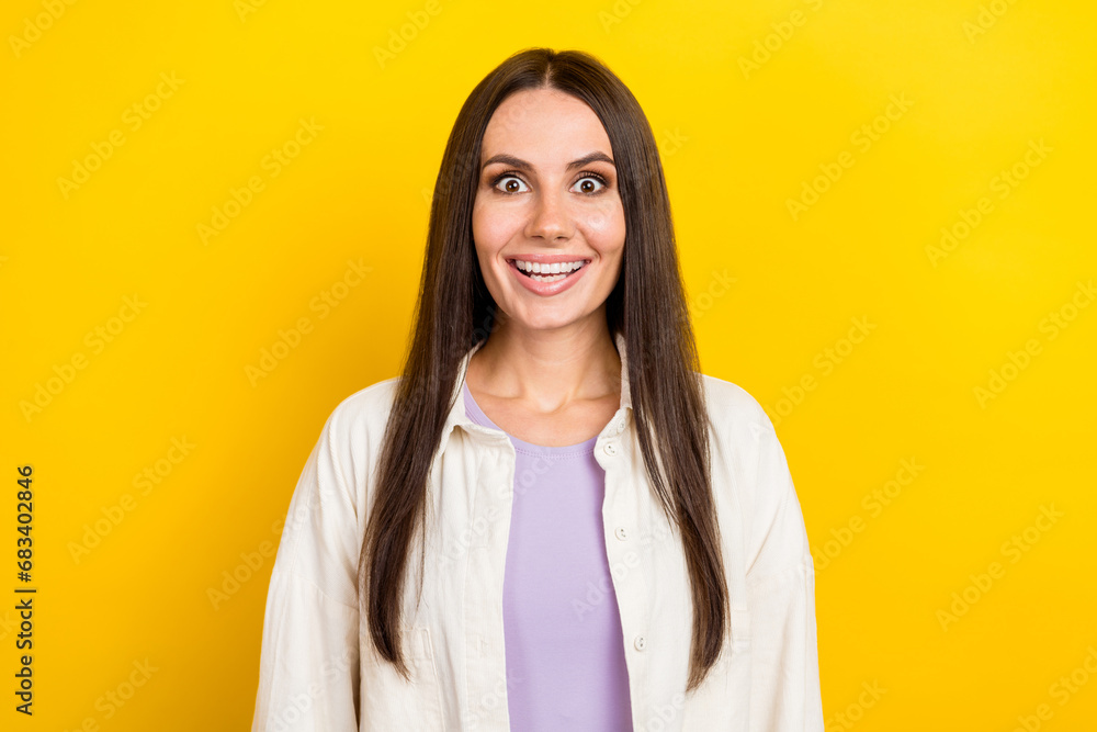 Photo portrait of pretty young girl excited toothy smile shocked dressed stylish white clothes isolated on yellow color background Photo portrait of pretty young girl excited toothy smile shocked dressed stylish white clothes isolated on yellow color background