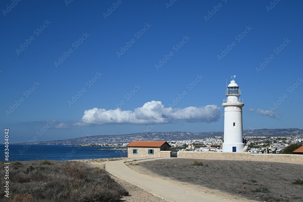 Old white lighthouse on the archaeological excavation site 