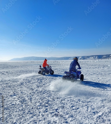 two children on a snowmobile.