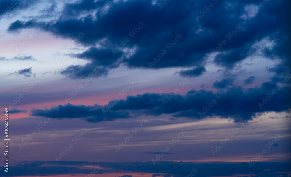 Dramatic dark moody blue and pink sunset sky. Natural background