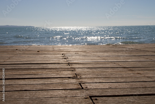 Wooden surface of the embankment  bottom view. Against the backdrop of the sea